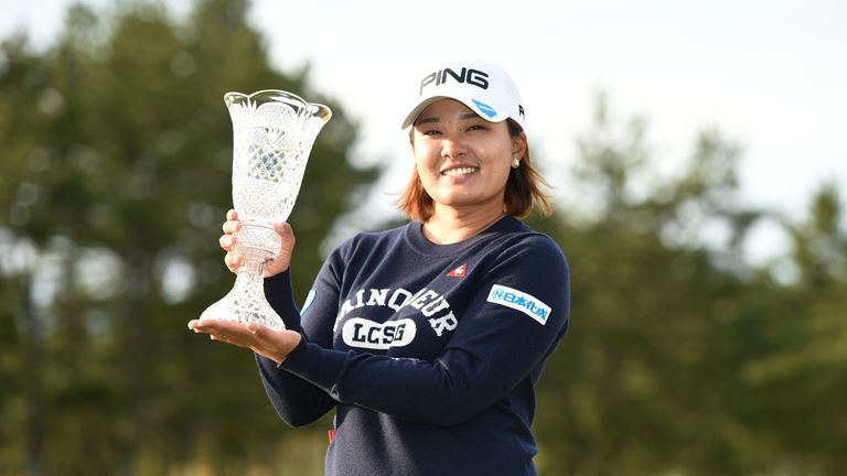 Ai Suzuki proudly displays her trophy after winning the Japan Classic
