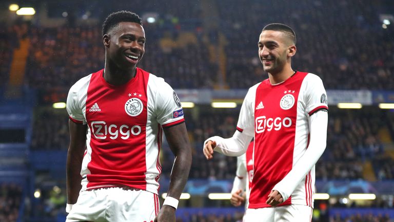 Quincy Promes and Hakim Ziyech celebrate as Ajax went 2-1 ahead at Stamford Bridge