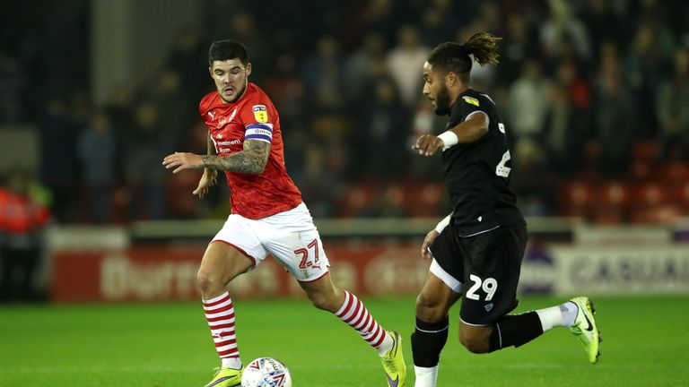 Barnsley's Alex Mowatt (left) and Bristol City's Ashley Williams battle for the ball 