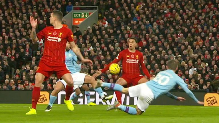 Trent Alexander-Arnold appears to handle the  ball against Manchester City