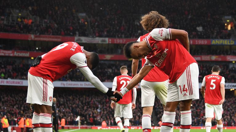 Alexandre Lacazette celebrates with Pierre-Emerick Aubameyang after setting up his Arsenal team-mate to score against Wolves at the Emirates Stadium
