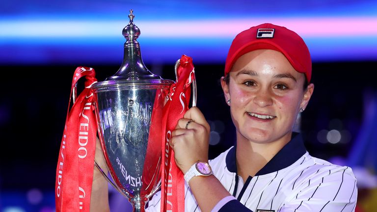Ashleigh Barty of Australia poses for photos as she celebrates with the Billie Jean King trophy after her Women's Singles final match victory against Elina Svitolina of Ukraine on Day Eight of the 2019 Shiseido WTA Finals at Shenzhen Bay Sports Center on November 03, 2019 in Shenzhen, China