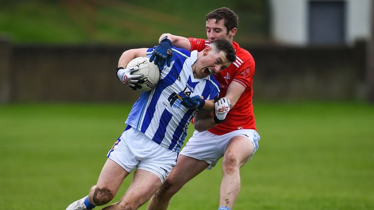 Ryan Basquel of Ballyboden St Enda's in action against Kevin Carr of Newtown Blues