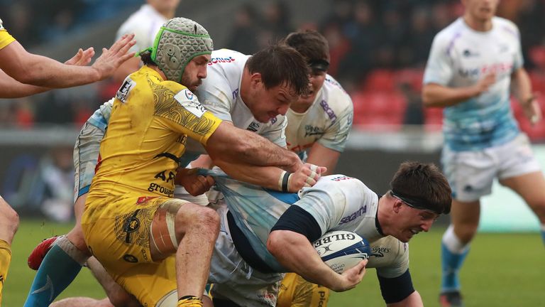 SALFORD, ENGLAND - NOVEMBER 24: Ben Curry of Sale Sharks is tackled during the Heineken Champions Cup Round 2 match between Sale Sharks and La Rochelle at AJ Bell Stadium on November 24, 2019 in Salford, England. (Photo by David Rogers/Getty Images)