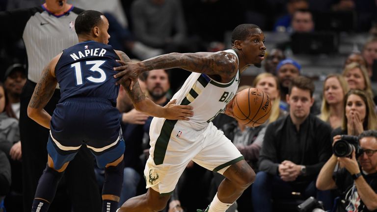 Eric Bledsoe of the Milwaukee Bucks drives to the basket against Shabazz Napier of the Minnesota Timberwolves