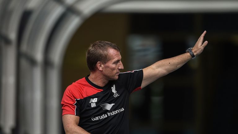 Liverpool's Northern Irish manager Brendan Rodgers gestures to Malaysian fans during a training session at the Bukit Jalil Stadium in Kuala Lumpur on July 23, 2015 on the eve of their friendly football match against Malaysia XI.