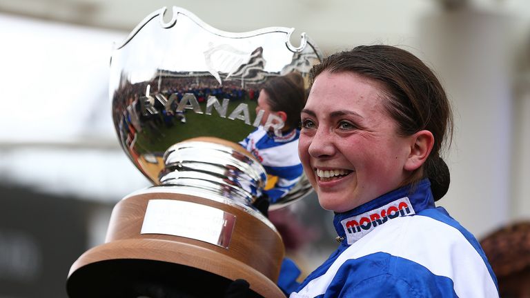 Jockey Bryony Frost poses with the trophy after she rides Frodon to victory during the Ryanair Chase during St Patrick's Thursday at Cheltenham Racecourse on March 14, 2019 in Cheltenham, England.