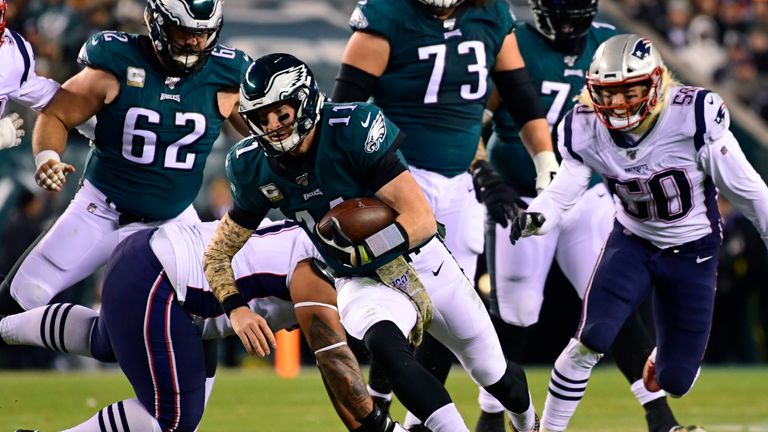 PHILADELPHIA, PA - NOVEMBER 17: Carson Wentz #11 of the Philadelphia Eagles is tackled during the first quarter at Lincoln Financial Field on November 17, 2019 in Philadelphia, Pennsylvania. The Patriots defeated the Eagles 17-10. (Photo by Corey Perrine/Getty Images)