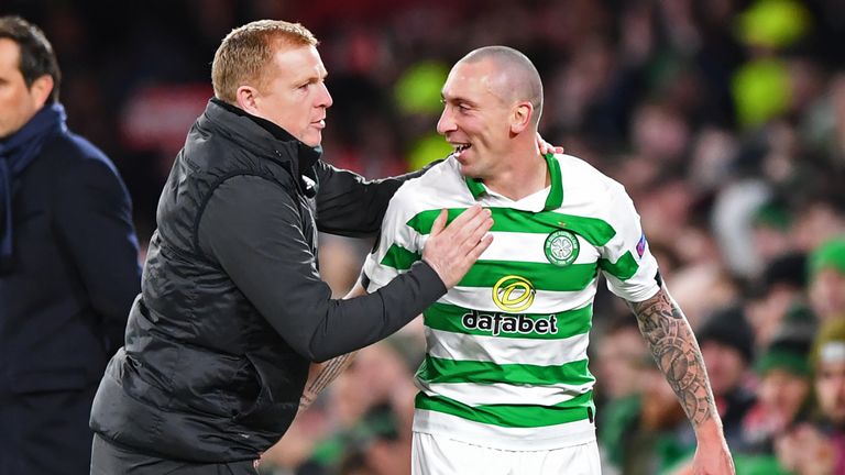 Neil Lennon congratulates Scott Brown as he leaves the pitch during Celtic's Europa League victory over Rennes