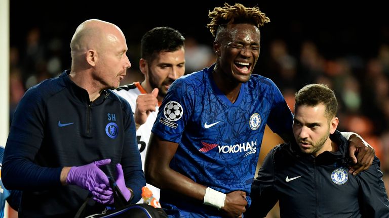 Tammy Abraham is helped off the pitch after he was injured in the Champions League game against Valencia