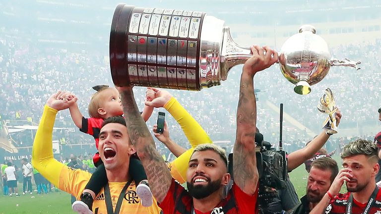 Gabriel Barbosa lifts the trophy after his two goal heroics