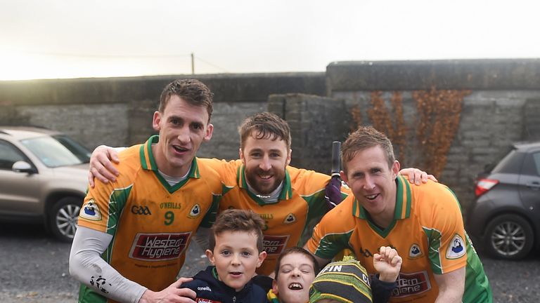 The next generation! Corofin players, Ronan Steede, Micheál Lundy, and Gary Sice celebrate with the McLoughlin brothers, Matthew, aged 8, Tom, aged 9, and Luke, aged 6 after the Galway county final