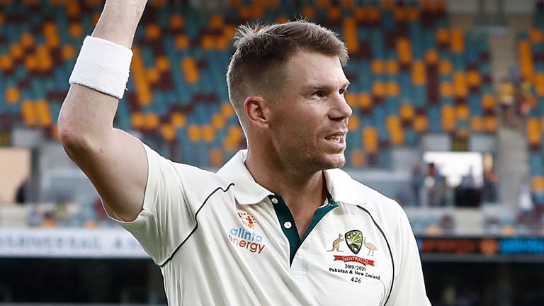 Australia's David Warner salutes the Brisbane crowd after scoring 151 not out in the first Test against Pakistan