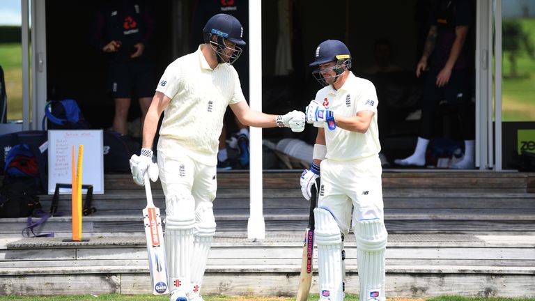 Dom Sibley (L) and Rory Burns walk out to bat in England's warm-up match against a New Zealand XI in Whangarei
