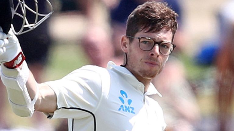 Mitchell Santner raises his bat after scoring his first Test hundred
