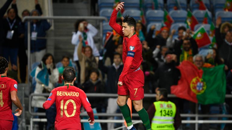 Cristiano Ronaldo of Portugal celebrates after scores the first goal against Lithuania 