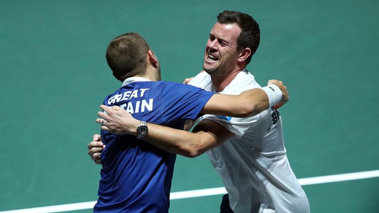 Dan Evans of Great Britain celebrates with Leon Smith after winning his quarter final match against Jan-Lennard Struff of Germany on Day Five of the 2019 Davis Cup at La Caja Magica on November 22, 2019 in Madrid, Spain