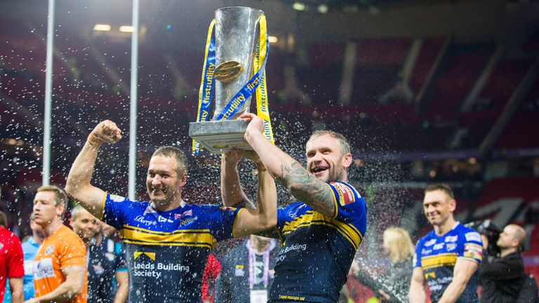 Picture by Alex Whitehead/SWpix.com - 10/10/2015 - Rugby League - First Utility Super League Grand Final - Leeds Rhinos v Wigan Warriors - Old Trafford, Manchester, England - Leeds captain Kevin Sinfield (R) soaks Danny McGuire (L) and Jamie Peacock (centre) in champagne.