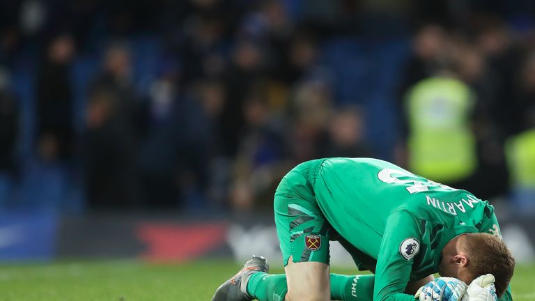 LONDON, ENGLAND - NOVEMBER 30: David Martin of West Ham United falls to the floor in celebration at full time of the Premier League match between Chelsea FC and West Ham United at Stamford Bridge on November 30, 2019 in London, United Kingdom. (Photo by James Williamson - AMA/Getty Images)