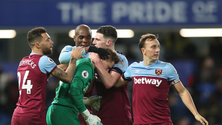 David Martin is consoled by his team-mates after winning with West Ham on his Premier League debut