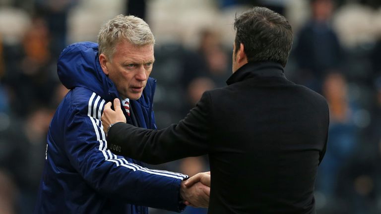 Sunderland's Scottish manager David Moyes (L) shakes hands with Hull City's Portuguese head coach Marco Silva after the English Premier League football match between Hull City and Sunderland at the KCOM Stadium in Kingston upon Hull, north east England on May 6, 2017. Sunderland won the game 2-0.