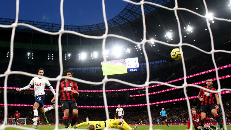 Alli races onto Toby Alderweireld's pass to lift in his second of the game