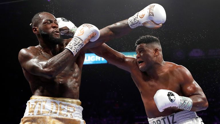 WBC heavyweight champion Deontay Wilder (L) takes a punch from Luis Ortiz during their title fight at MGM Grand Garden Arena on November 23, 2019 in Las Vegas, Nevada. Wilder retained his title with a seventh-round knockout. 