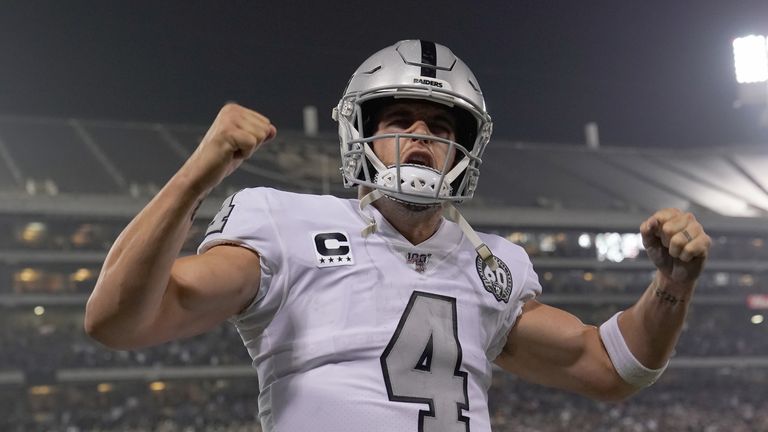 Quarterback Derek Carr #4 of the Oakland Raiders celebrates after Josh Jacobs (not pictured) scored a touchdown late in the fourth quarter against the Los Angeles Chargers at RingCentral Coliseum on November 07, 2019 in Oakland, California.
