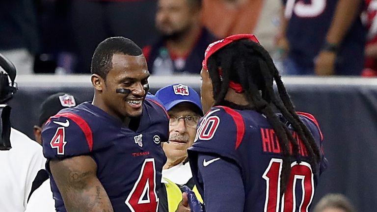 Quarterback Deshaun Watson and wide receiver DeAndre Hopkins of the Houston Texans celebrate on the sidelines after a touchdown