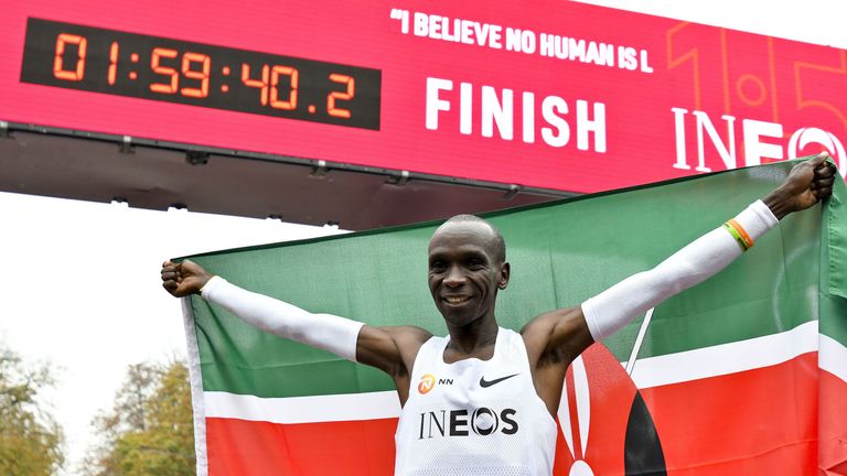 Kenya's Eliud Kipchoge celebrates breaking the mythical two-hour barrier for the marathon on October 12 2019 in Vienna.