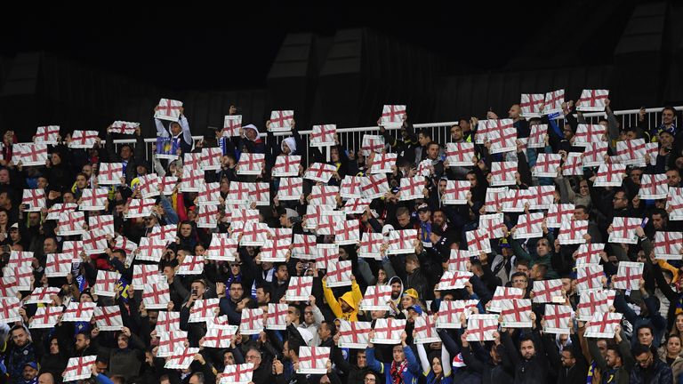Fans hold up England flags during the UEFA Euro 2020 Qualifier between Kosovo and England at the Pristina City Stadium on November 17, 2019 in Pristina, Kosovo.