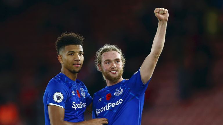 Mason Holgate and Tom Davies celebrate with the travelling fans