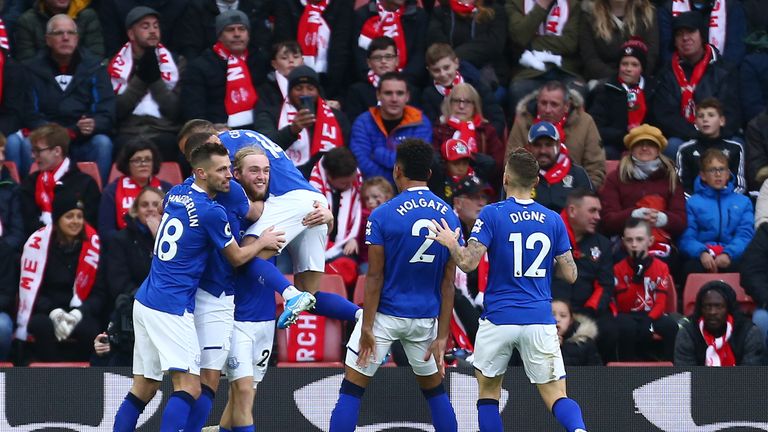 Davies is mobbed after firing Everton ahead on Saturday at Saints