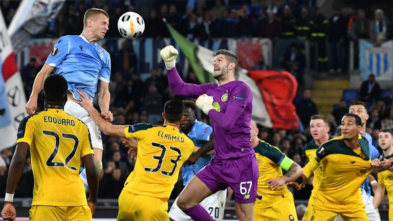 Star man: Fraser Forster repels another Lazio attack