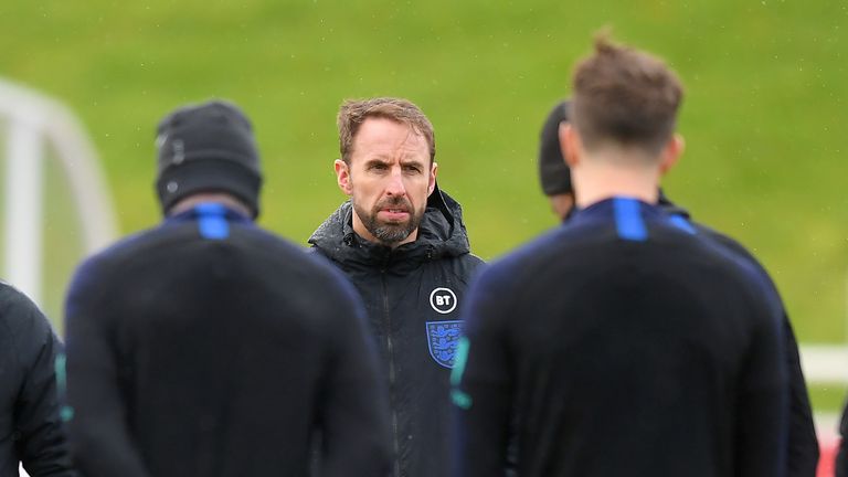 Gareth Southgate talks to his players during a training session at St George's Park
