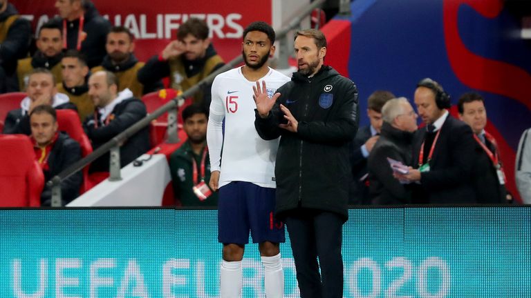 Gareth Southgate gives instructions to Joe Gomez as he prepares to come on as a substitute vs Montenegro