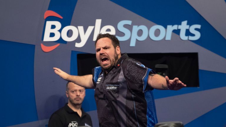 Adrian Lewis booked his place in the knockout stages of the Grand Slam of Darts with a win over Jim Williams