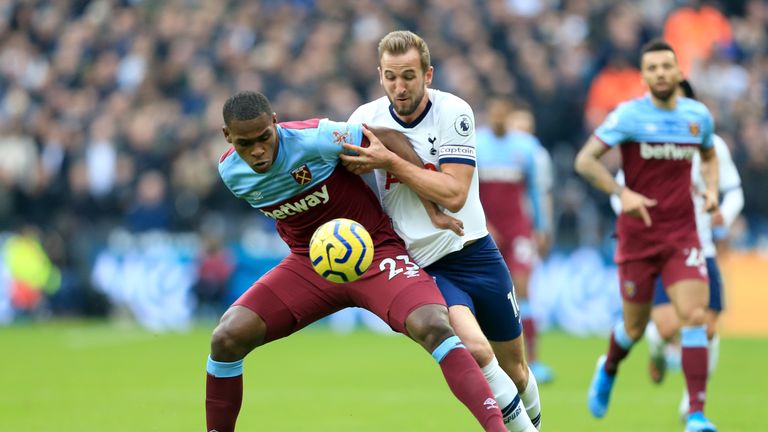 Harry Kane tussles with Issa Diop at the London Stadium