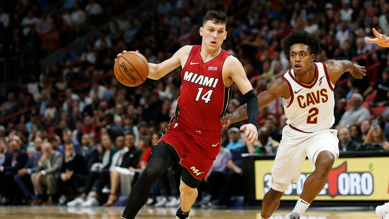 Tyler Herro of the Miami Heat drives to the basket against Collin Sexton of the Cleveland Cavaliers