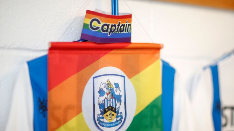 HUDDERSFIELD, ENGLAND - NOVEMBER 26: Christopher Schindler of Huddersfield Town's LGBT rainbow Captain's armband and pendant before the Sky Bet Championship match between Huddersfield Town and Swansea City at John Smith's Stadium on November 26, 2019 in Huddersfield, England. (Photo by John Early/Getty Images)