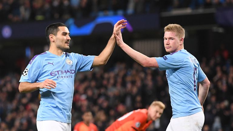 Ilkay Gundogan of Manchester City celebrates with teammate Kevin De Bruyne after scoring his team's first goal during the UEFA Champions League group C match between Manchester City and Shakhtar Donetsk at Etihad Stadium