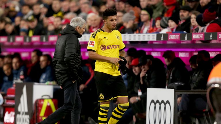 Jadon Sancho appears dejected as he leaves the pitch during Bayern Munich vs Borussia Dortmund