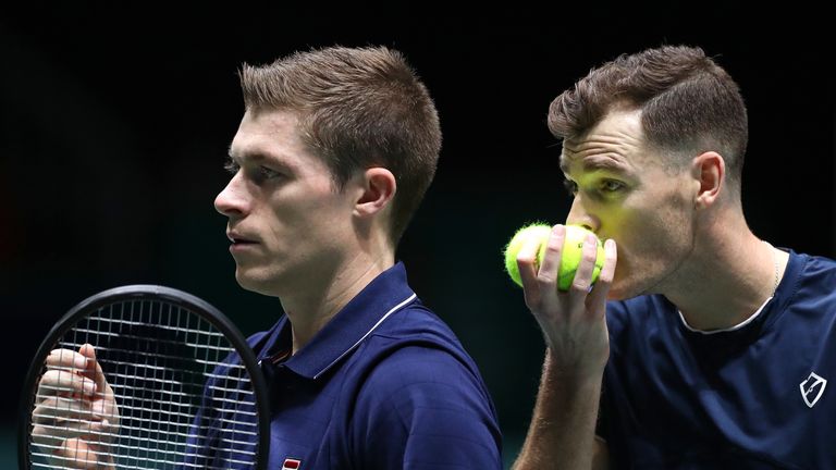 Jamie Murray of Great Britain speaks to his playing partner Neal Skupski before serving during their Davis Cup Group Stage match against Wesley Koolhof and Jean-Julien Rojer of the Netherlands during Day Three of the 2019 Davis Cup at La Caja Magica on November 20, 2019 in Madrid, Spain.