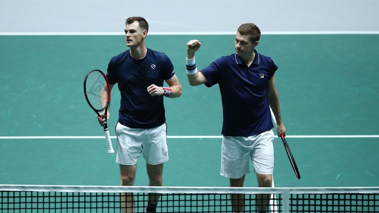Jamie Murray and Neal Skupski of Great Britain celebrate following the Great Britain v Kazakhstan doubles match during Day 4 of the 2019 Davis Cup at La Caja Magica on November 21, 2019 in Madrid, Spain