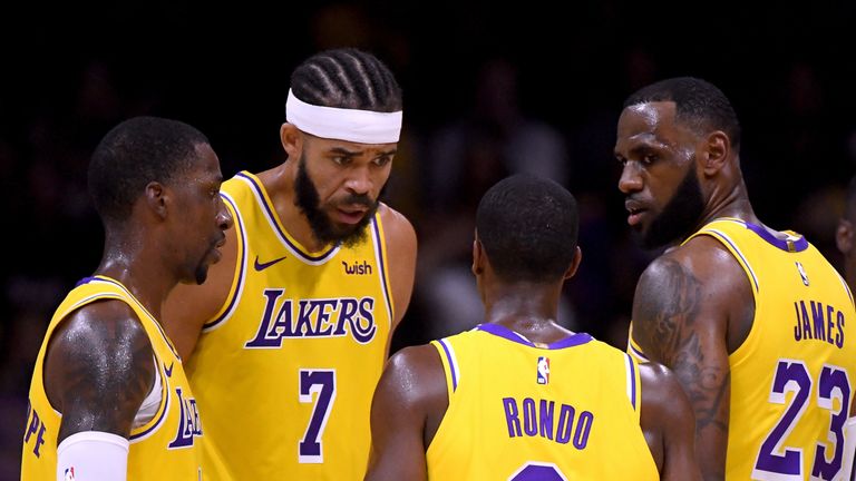 Javale McGee, Rajon Rondo and LeBron James in discussion during a preseason game