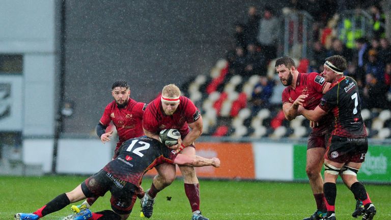 NEWPORT, WALES - JANUARY 26: Jeremy Loughman of Munster is tackled by Jack Dixon of Dragons during the Guinness Pro14 Round 14 match between the Dragons and Munster Rugby at Rodney Parade on January 26, 2019 in Newport, Wales. (Photo by Athena Pictures/Getty Images)