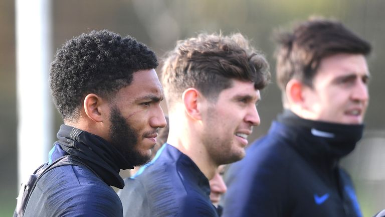 Joe Gomez is pictured with John Stones and Harry Maguire during England training