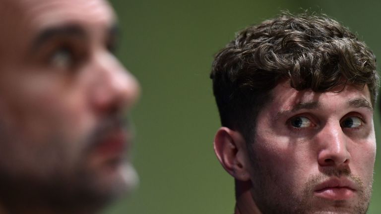 John Stones and Pep Guardiola faced questions from reporters in Italy