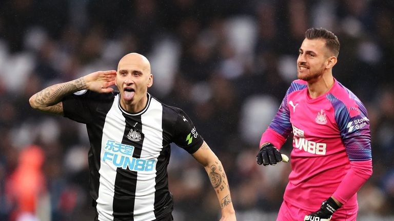 Jonjo Shelvey cups his ear in celebration after scoring Newcastle's third
