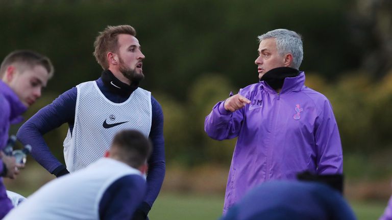 New Spurs head coach Jose Mourinho talks to Harry Kane during training